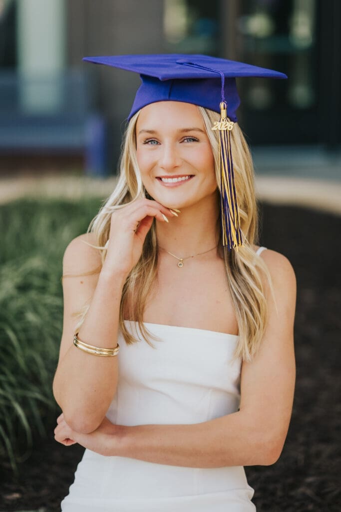 College graduate portrait in cap and gown at Minnesota State University Mankato