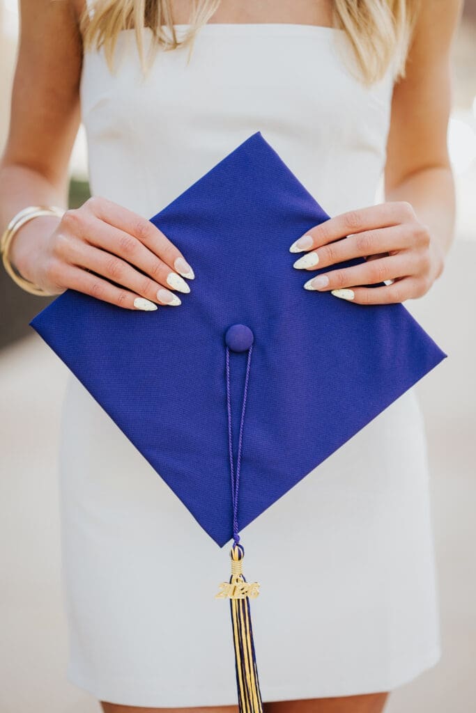 Purple graduation cap and gown during Minnesota State University Mankato grad session