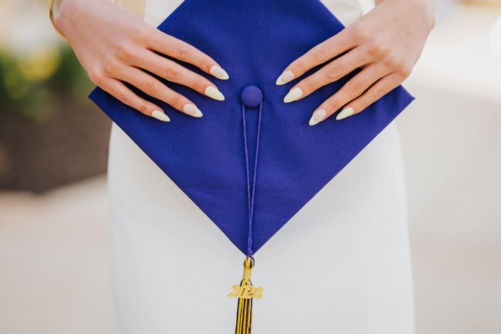 Purple graduation cap detail photo during college grad session at Minnesota State University Mankato