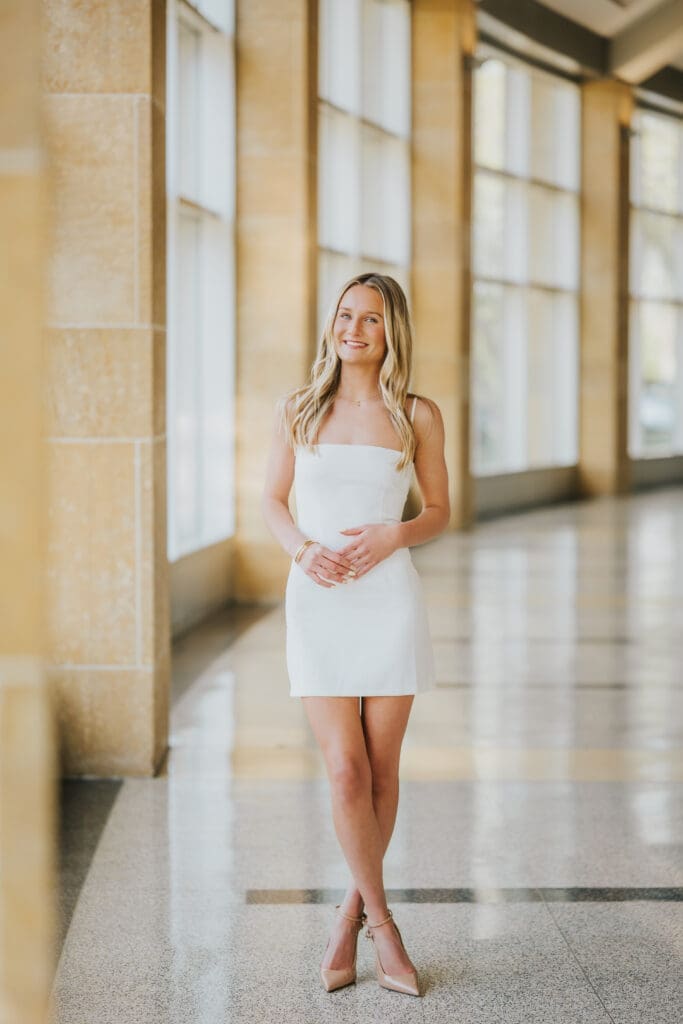College graduate portrait inside Minnesota State University Mankato during graduation session