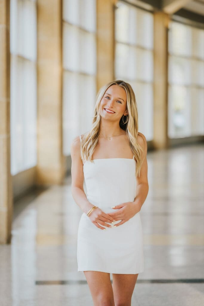 College graduate portrait inside the Taylor Center at Minnesota State University Mankato campus building